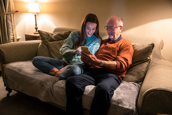 teen and grandpa on phone